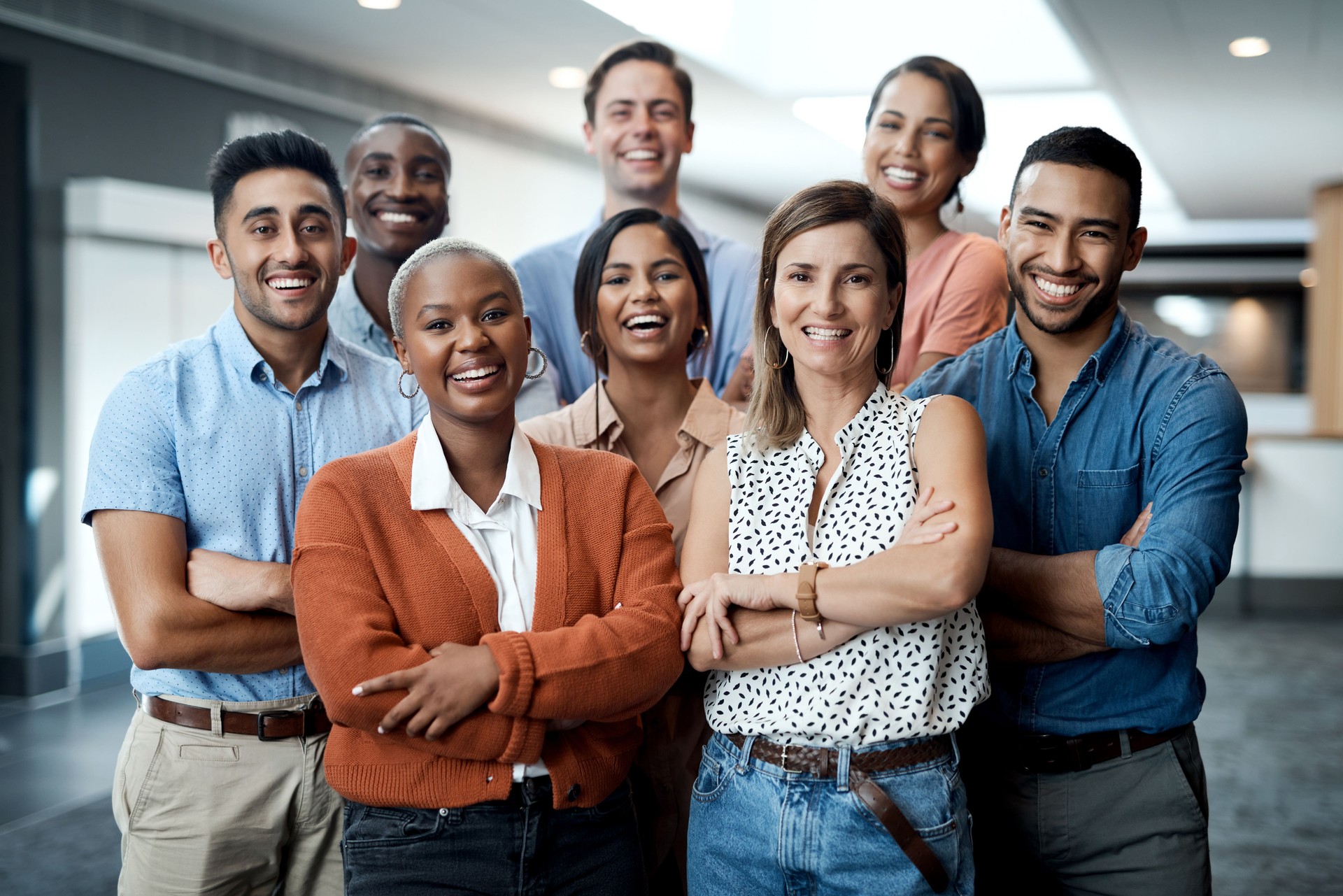 Portrait of a group of confident young businesspeople working together in a modern office